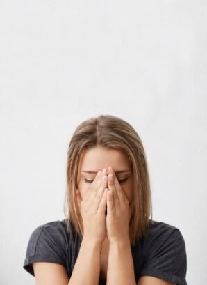 Woman experiencing ear and neck pain