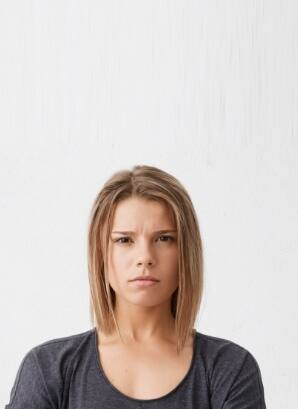 Woman experiencing chronic headaches and migraines